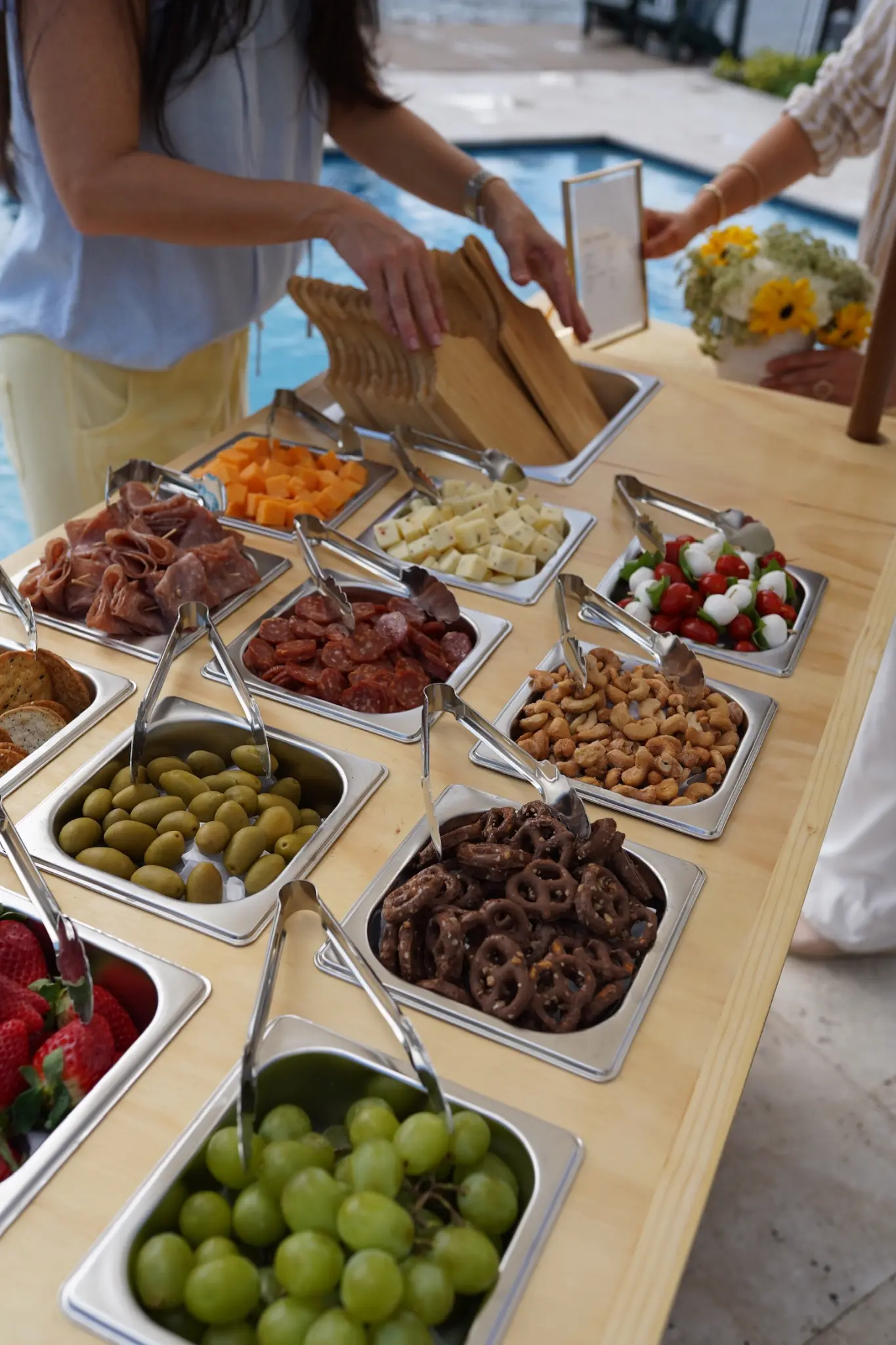 Artisanal grazing board with cheeses, fruit, crackers, and charcuterie